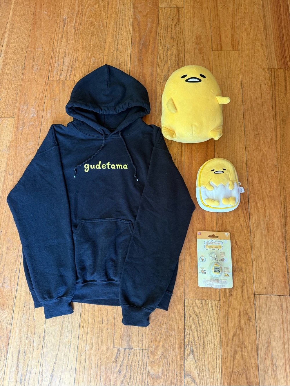 Sanrio Gudetama Black Hoodie with Yellow Plush Accessories and Tamagotchi